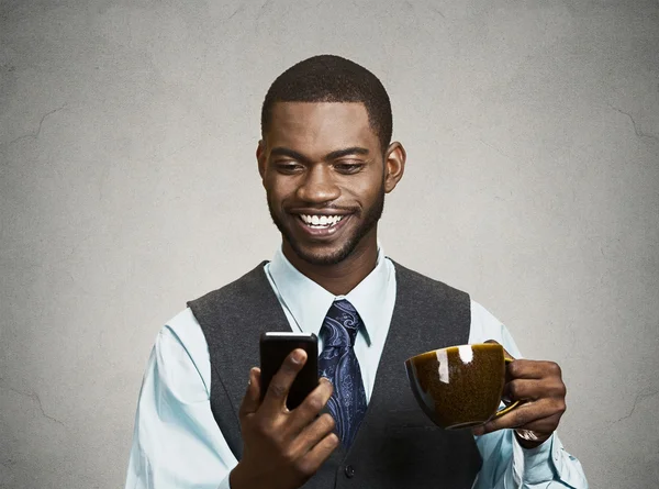 Happy executive holding mobile, smart phone, drinking coffee — Stock Photo, Image