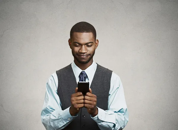 Happy executive man holding smart phone, reading news — Stock Photo, Image