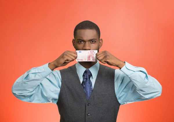 Serious bribery man covers his mouth with euro bill currency — Stock Photo, Image