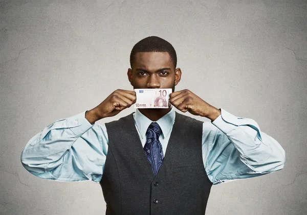 Serious bribery man covers his mouth with euro bill currency — Stock Photo, Image
