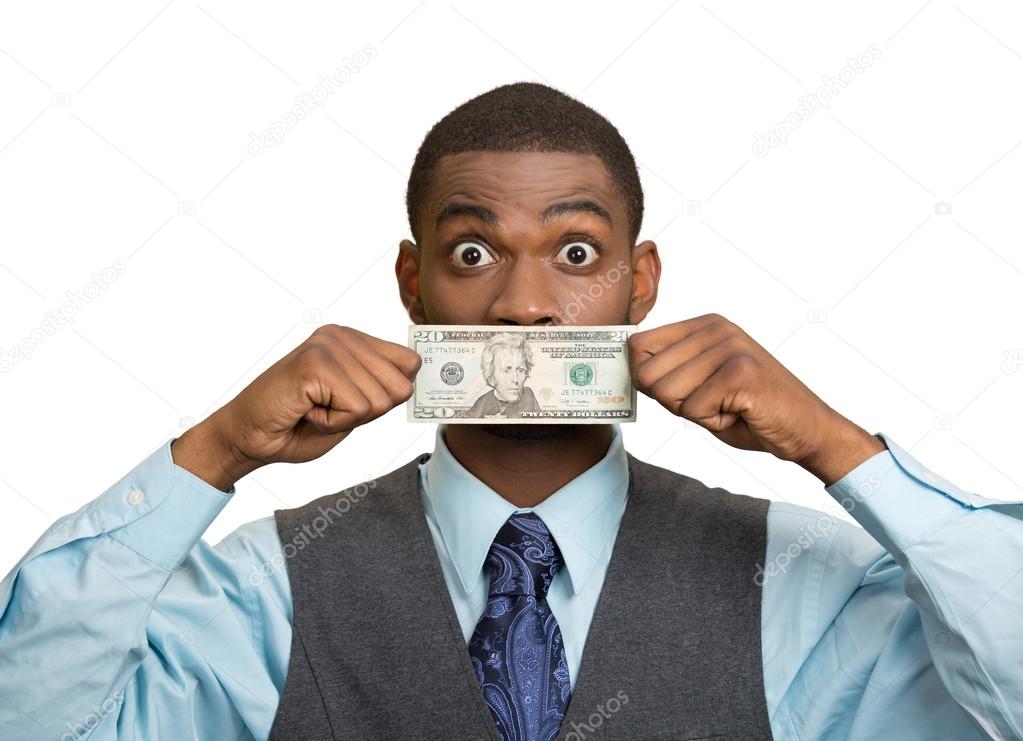 Shocked man with dollar bill curency covering his mouth