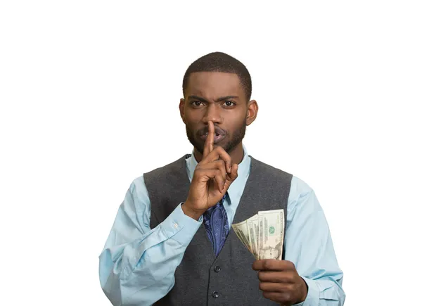 Hombre soborno con billetes de dólar en la mano y gesto tranquilo — Foto de Stock