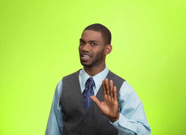 Angry executive gesturing with hands to stop