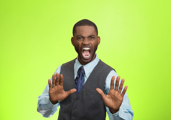 Angry executive gesturing with hands to stop