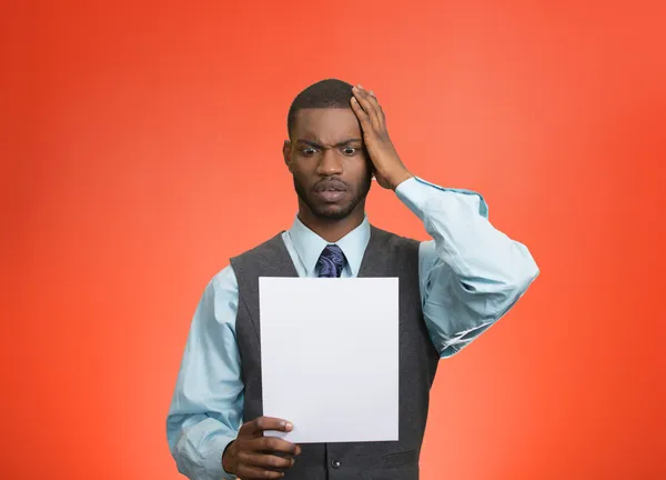 Man holding paper, statement, shocked with bad news — Stock Photo, Image