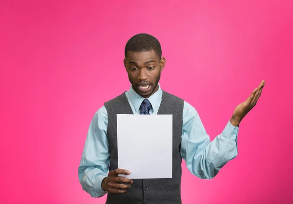 Man holding paper, statement, shocked with bad news — Stock Photo, Image