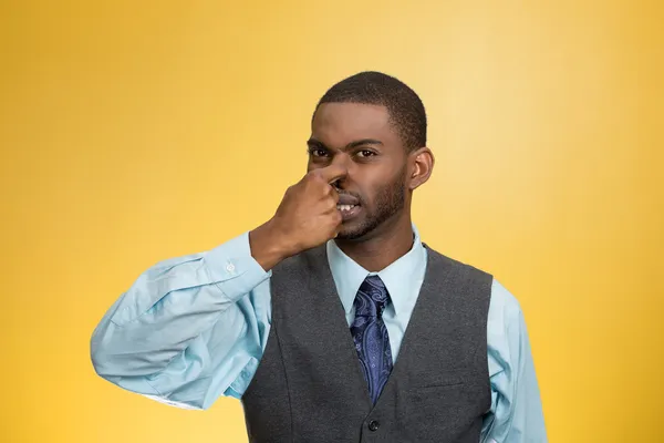 Man pinches his nose, very bad smell, odor — Stock Photo, Image