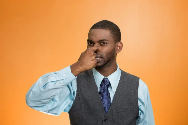 Man pinches his nose, very bad smell, odor — Stock Photo, Image