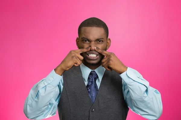 Man pinches his nose, very bad smell, odor — Stock Photo, Image