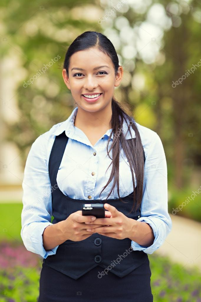 Happy business woman using smart phone