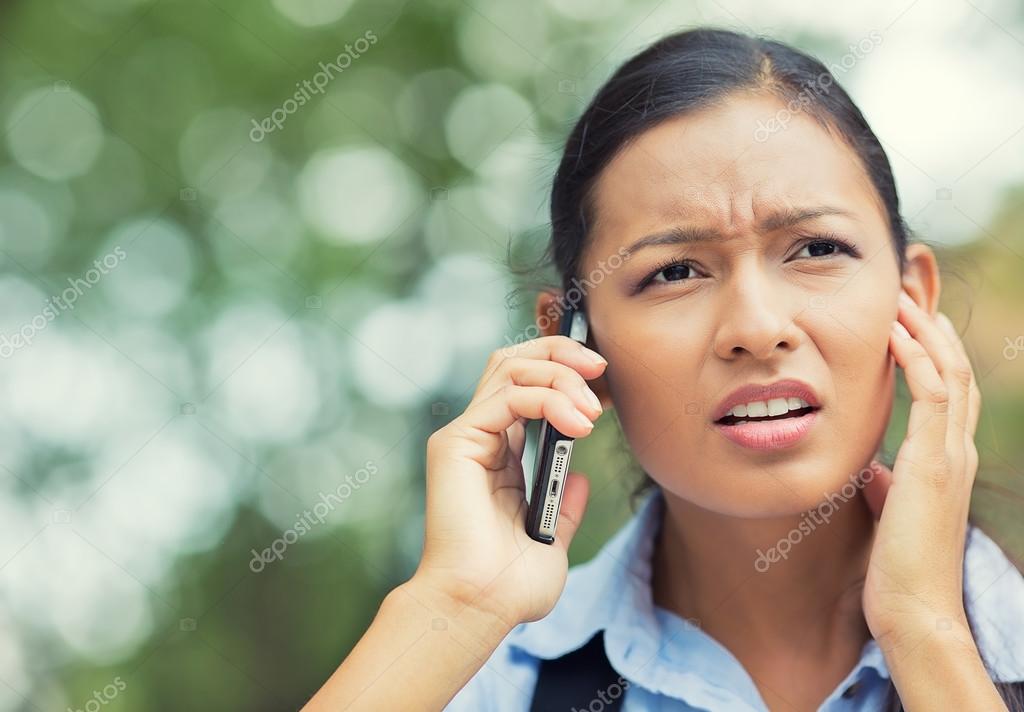 Unhappy, stressed woman talking on mobile phone — Stock Photo