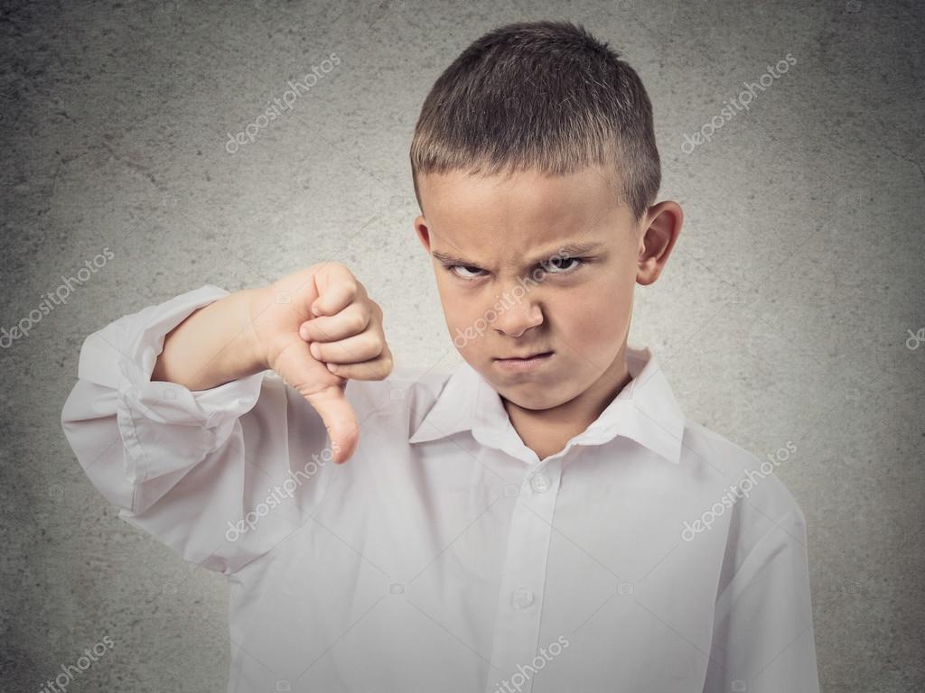 Boy Giving Thumbs Down Gesture Stock Photo by ©SIphotography 51264191