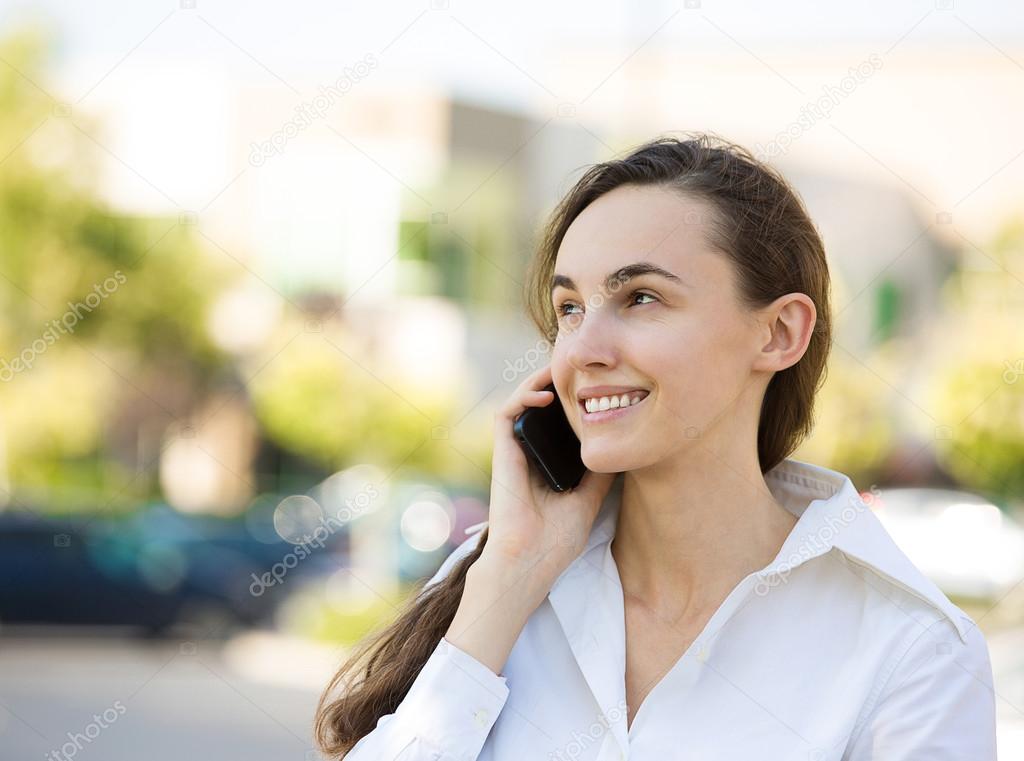 Happy woman talking on a phone