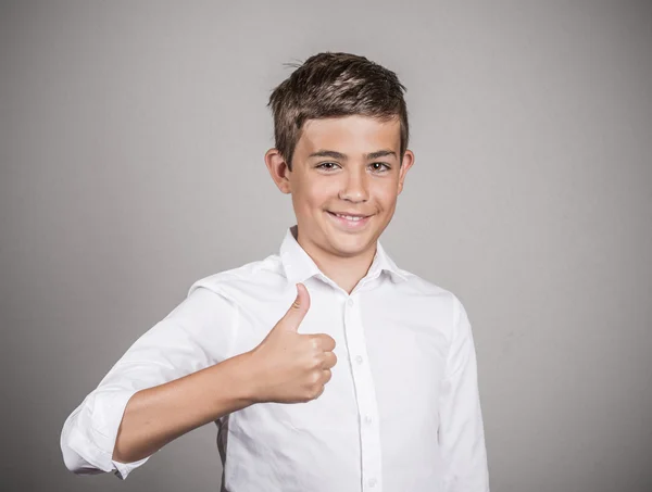 Teenager giving thumbs up gesture — Stock Photo, Image