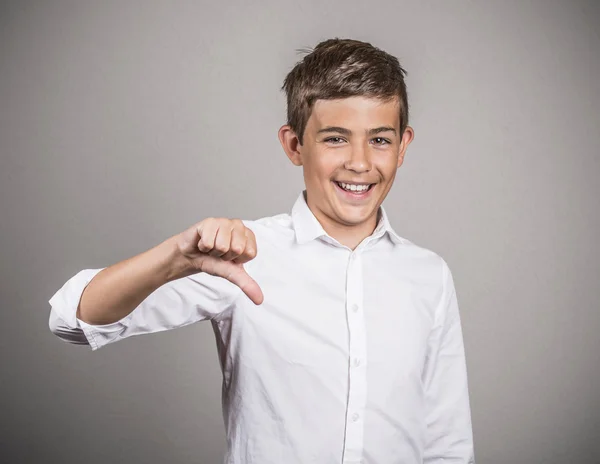 Happy young guy giving thumbs down gesture — Stock Photo, Image