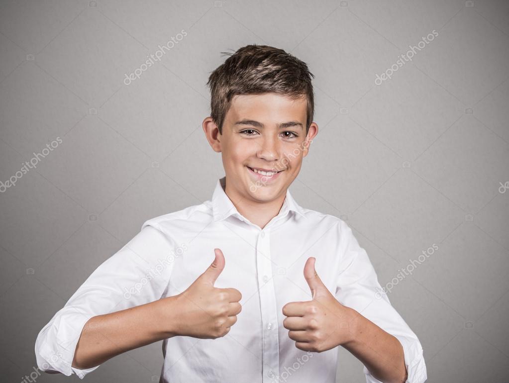 Teenager giving thumbs up gesture