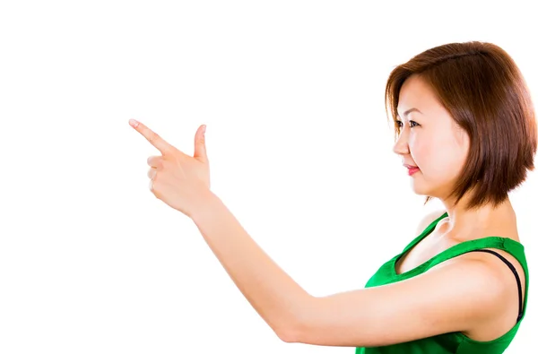 Businesswoman pointing and looking to the side — Stock Photo, Image