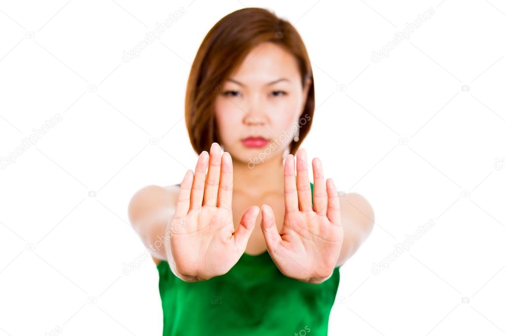 Woman with her hands signaling to stop