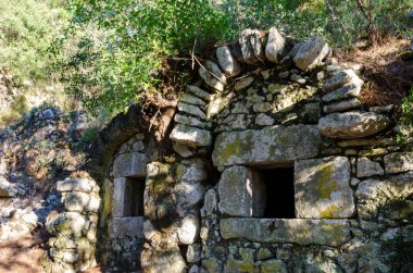 The ruins of buildings of the ancient city of Olympos (Olympus). Cirali beach, Antalya region, Turkey.