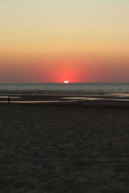 sunset over the sea, sandy beach