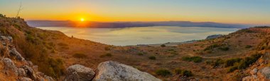 Panoramic sunset view of the Sea of Galilee from the Golan Heights, Northern Israel clipart