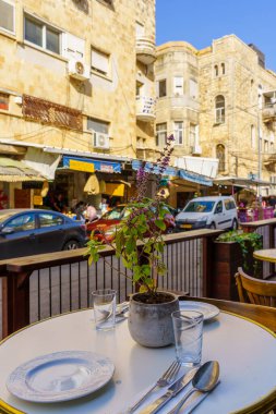 Haifa, Israel - May 12, 2022: Restaurants scene in Talpiot Market, with locals and visitors, Hadar HaCarmel Neighborhood, Haifa, Israel