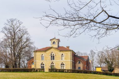 View of the Cascina San Fedele building in the Monza Park, on a clear winter day. Monza, Lombardy, Northern Italy