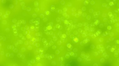 yüzen parlak daireler ile çevre yeşil bulanık arkaplan.