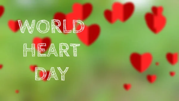 world heart day word isolated on green and red heart blur background. concept for heart health.