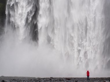 Skogafoss waterfall and photographers clipart