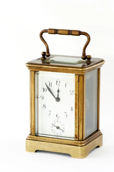 Velho relógio em uma moldura de latão — Fotografia de Stock