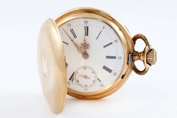 Pocket watch in a gold case on a white background, zoom — Stock Photo, Image