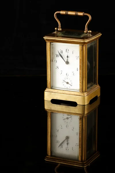 Old antique clock on a dark background — Stock Photo, Image