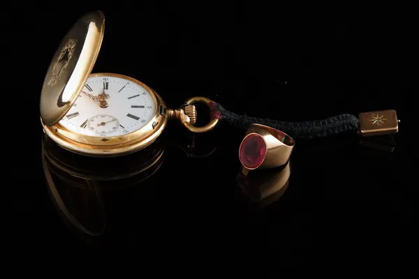 Old pocket watch on dark glass background — Stock Photo, Image