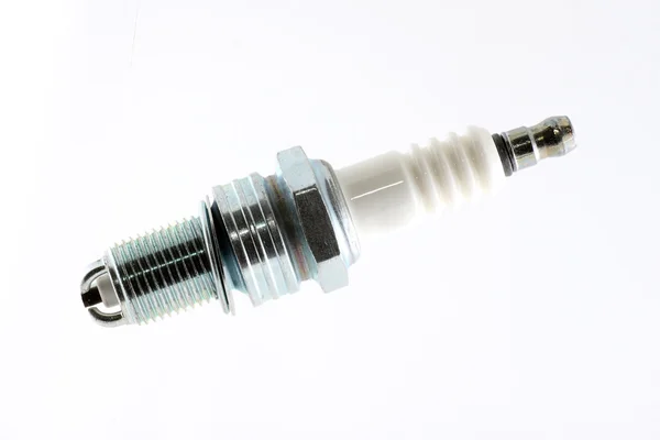 Spark plug on a white background in a larger — Stock Photo, Image