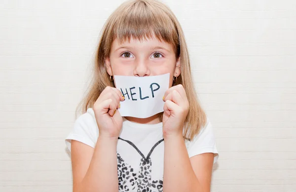 Little girl with sign help — Stock Photo, Image