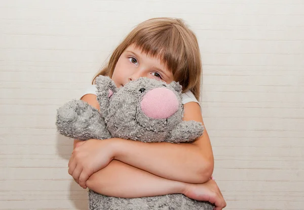 Girl dreaming with toy cat — Stock Photo, Image