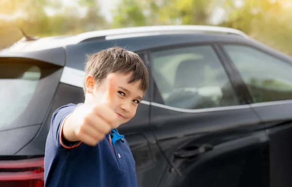Happy Young Boy Showing Thumb While Stnading Next Car School — Stock Photo, Image