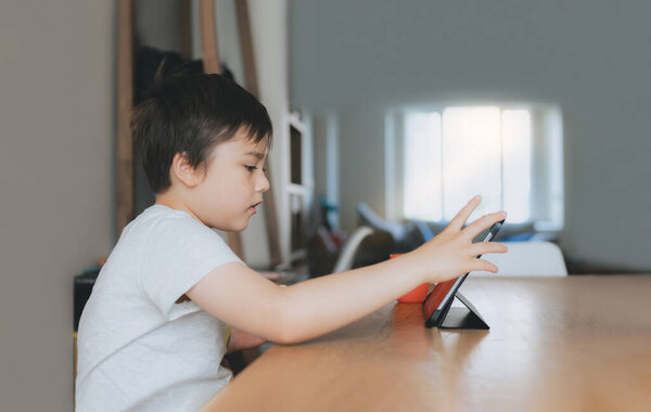 Kid Playing Game Online Friends Tablet Cinematic Portrait Young Boy Royalty Free Stock Images