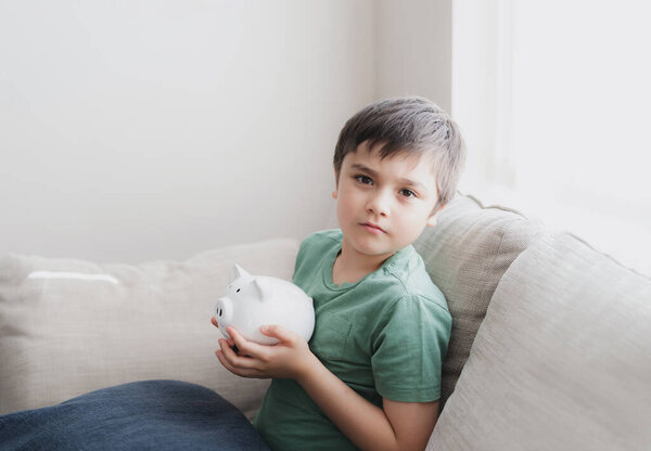 Happy Boy Holding Piggy Bank Smiling Face Indoor Portrait Cheerful Stock Picture