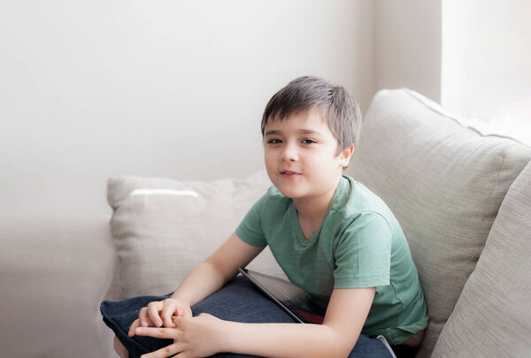 Portrait Kid Using Tablet Playing Game Internet Friend Homeschooling Kid Stock Photo