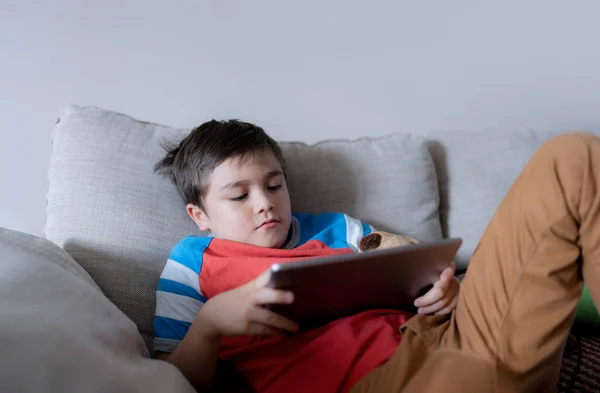 School Kid Using Tablet Readying Story Internet Happy Boy Sitting — Stok Foto