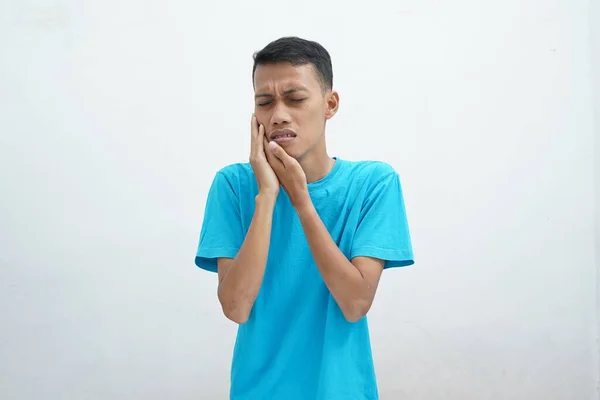 Asian Young Man Wearing Blue Shirt Touches His Face Closes — стоковое фото