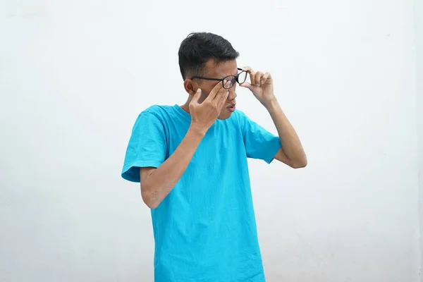 Young Asian Wearing Unhealthy Blue Shirt Glasses Rubbing Eyes Suffering — 스톡 사진