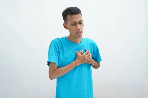 Young Man Blue Shirt Strong Heart Attack Chest Pain Isolated — стоковое фото