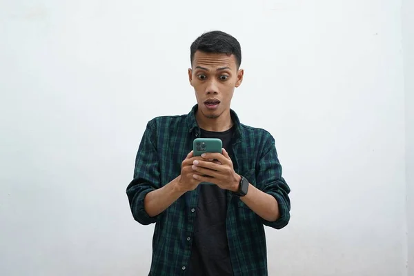 Asian Man Using Smartphone Looks Phone Looks Very Surprised Wears — стокове фото