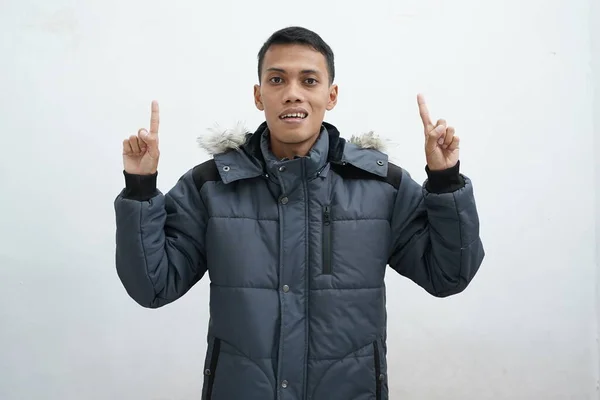 Asian Man Wearing Winter Jacket Isolated White Background While Pointing — Foto Stock