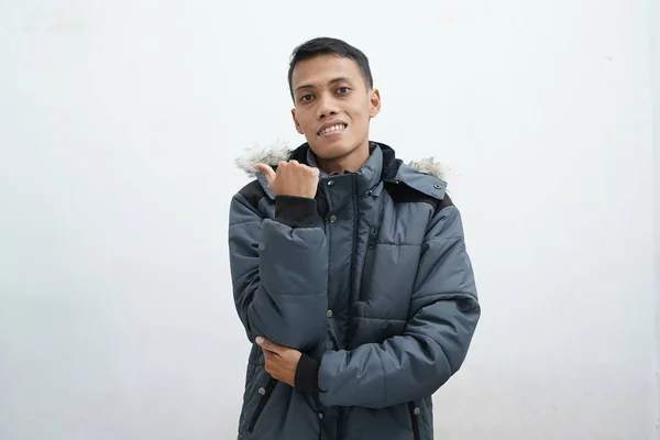 Asian Man Wearing Winter Jacket Isolated White Background Pointing Side — Stock Photo, Image