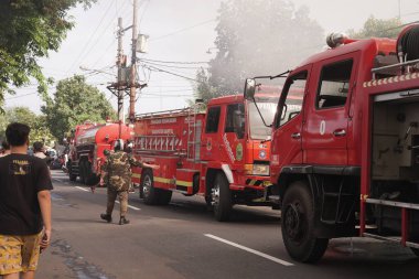 Fire trucks that come and are ready to be at the location of the furniture warehouse fire. : Yogyakarta, Indonesia - 12 May 2022