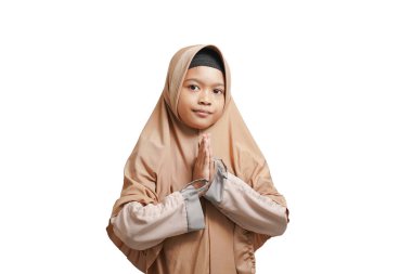 Asian Muslim girl welcoming guests / Eid greetings on white background